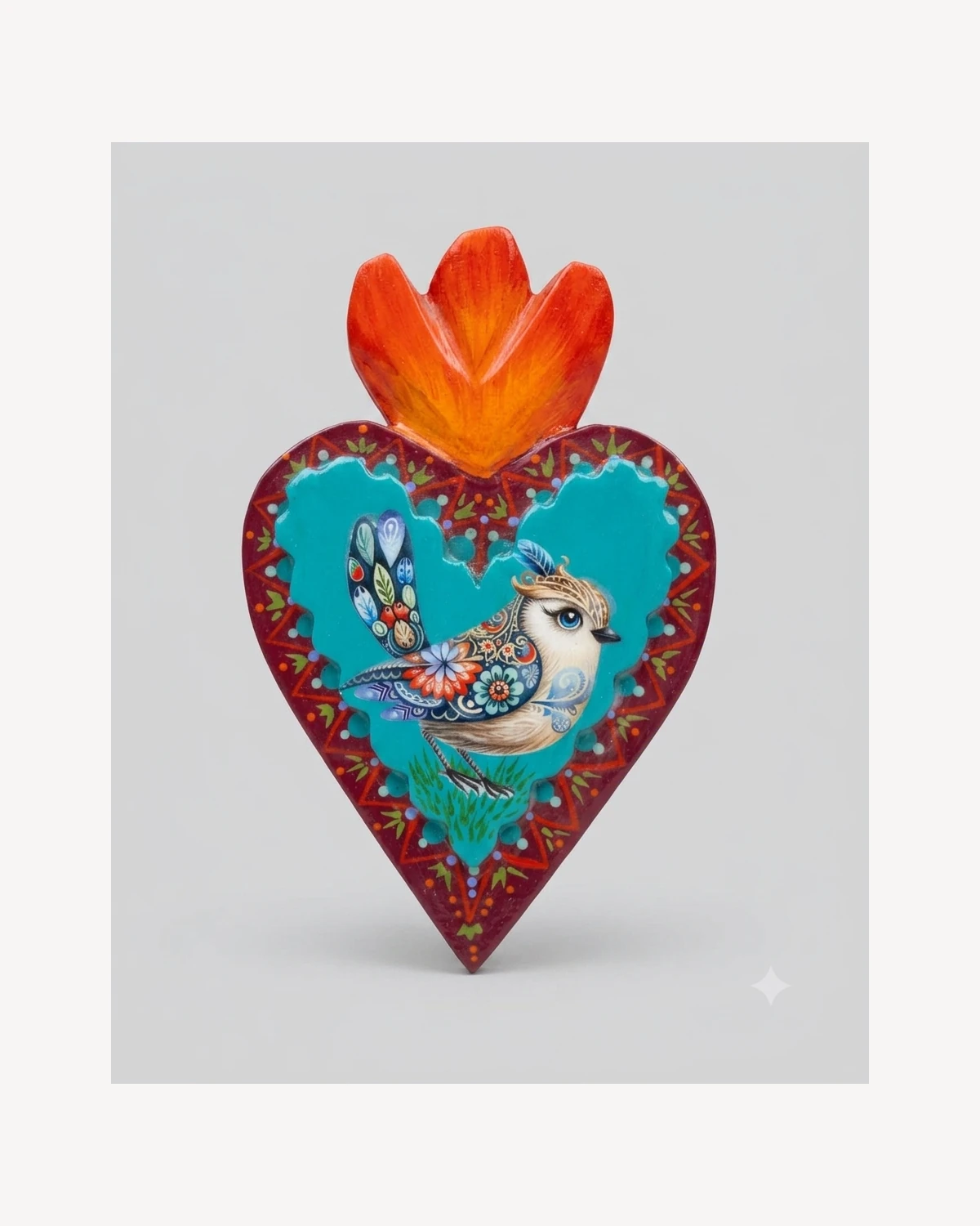 Objeto decorativo en forma de corazón colorido con pájaro, vista principal.